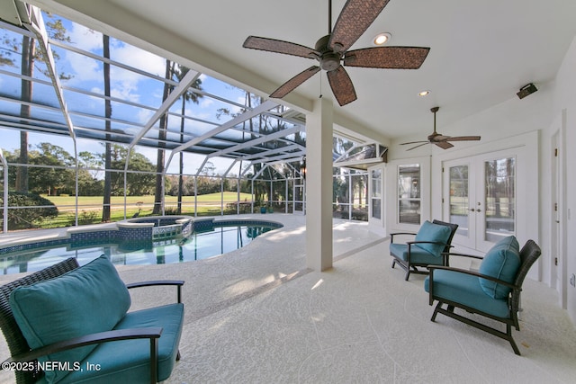 view of swimming pool featuring a patio area, a lanai, an in ground hot tub, and french doors