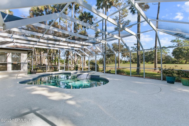 view of pool featuring a patio area, a lanai, and an in ground hot tub