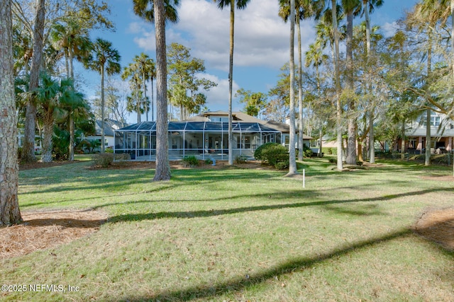 view of yard with a lanai