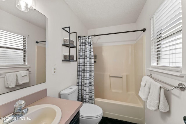 full bathroom featuring shower / bathtub combination with curtain, vanity, toilet, and a textured ceiling