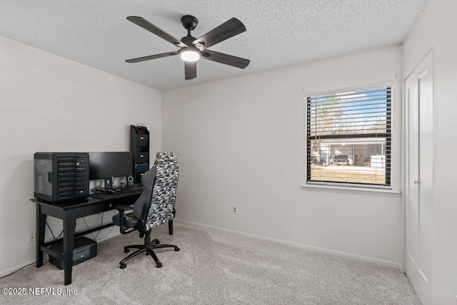 office with ceiling fan, light colored carpet, and a textured ceiling