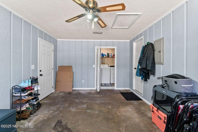 garage featuring separate washer and dryer, electric panel, and ceiling fan