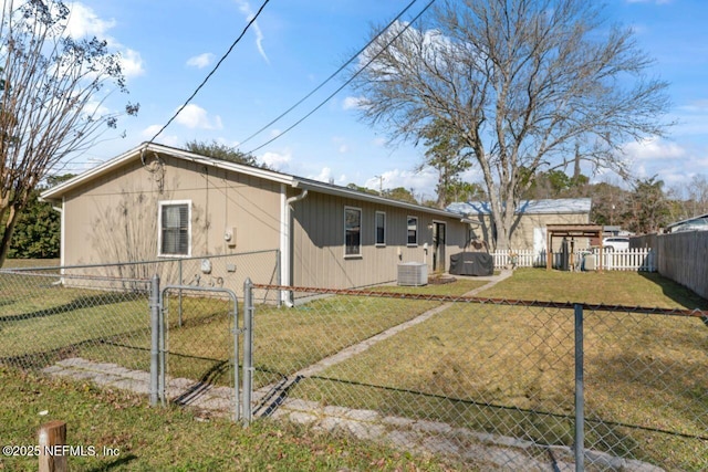 view of property exterior with a yard and cooling unit