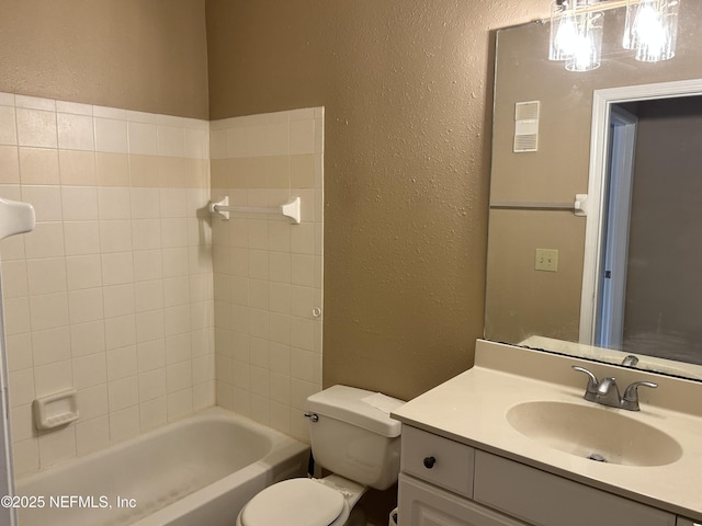 full bathroom featuring vanity, tub / shower combination, and toilet