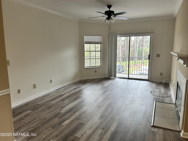 unfurnished living room with ceiling fan, crown molding, and dark wood-type flooring