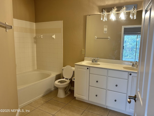 full bathroom with tile patterned floors, bathing tub / shower combination, vanity, and toilet