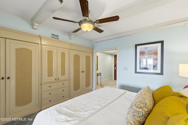 bedroom with ceiling fan, a closet, beamed ceiling, and ornamental molding