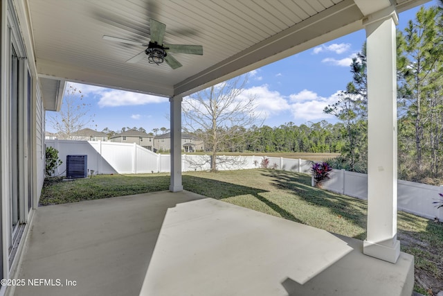 view of patio / terrace with central AC unit, ceiling fan, and a water view