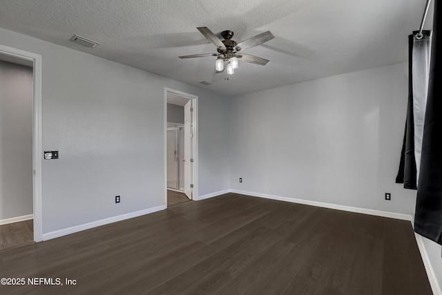 unfurnished bedroom featuring a textured ceiling, ceiling fan, and dark wood-type flooring