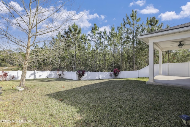 view of yard with ceiling fan