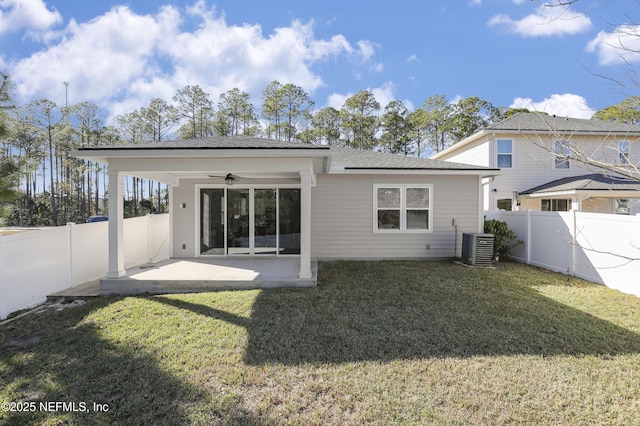 back of house with cooling unit, ceiling fan, a patio area, and a lawn