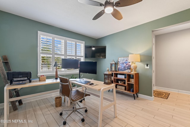 office space with light wood-type flooring and ceiling fan