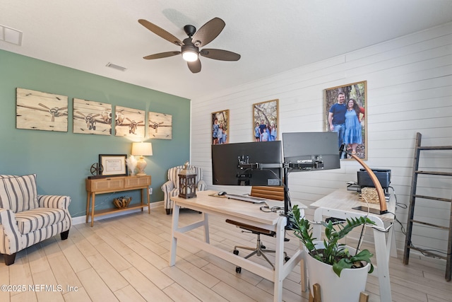 office area featuring light hardwood / wood-style flooring and ceiling fan