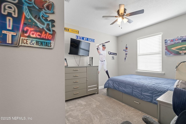 bedroom featuring light carpet and ceiling fan