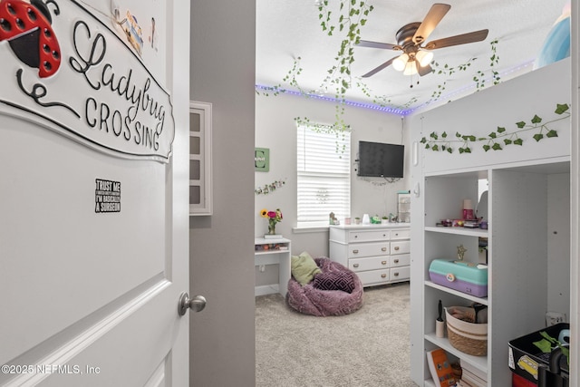 carpeted bedroom featuring ceiling fan