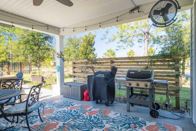 view of patio / terrace with ceiling fan and a grill