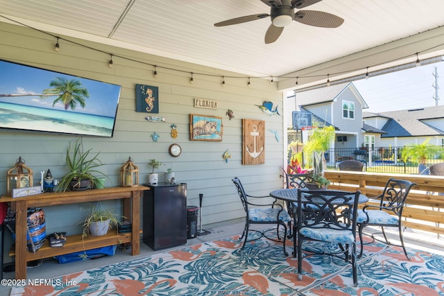 view of patio featuring ceiling fan