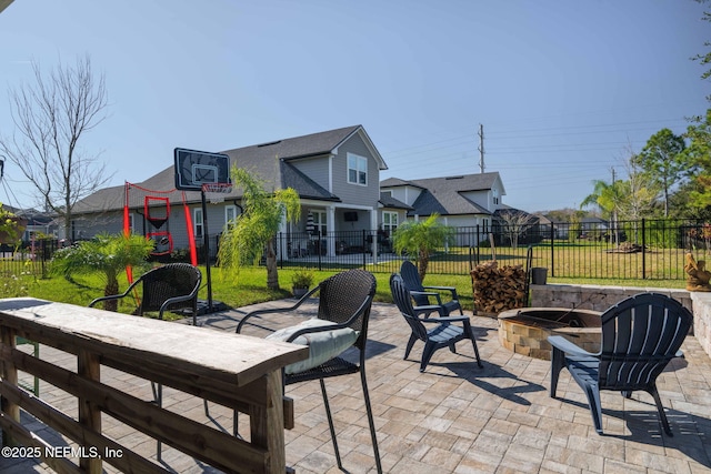 view of patio with a fire pit