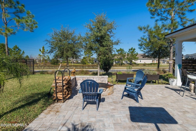 view of patio with a fire pit