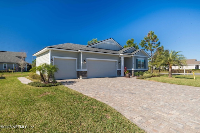 single story home featuring a garage and a front lawn