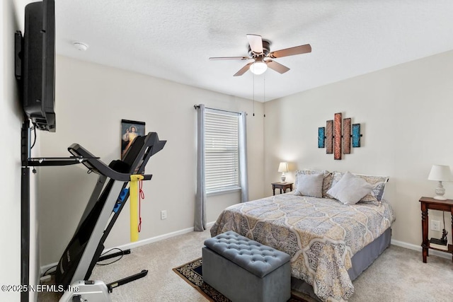 bedroom featuring ceiling fan and light carpet