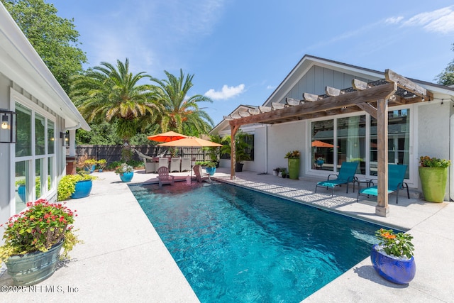 view of swimming pool with a pergola and a patio area