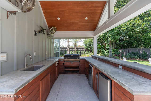 view of patio / terrace with an outdoor kitchen, grilling area, and sink