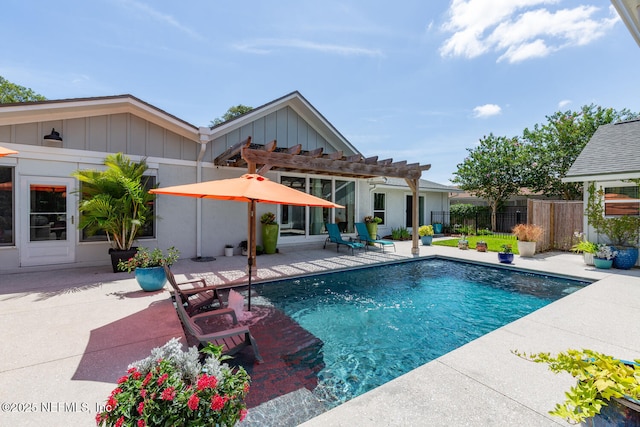 view of pool with a patio area and a pergola