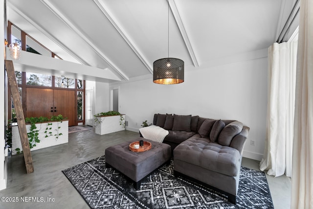 living room with high vaulted ceiling, concrete floors, and beamed ceiling