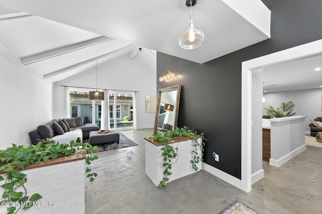 interior space featuring lofted ceiling with beams