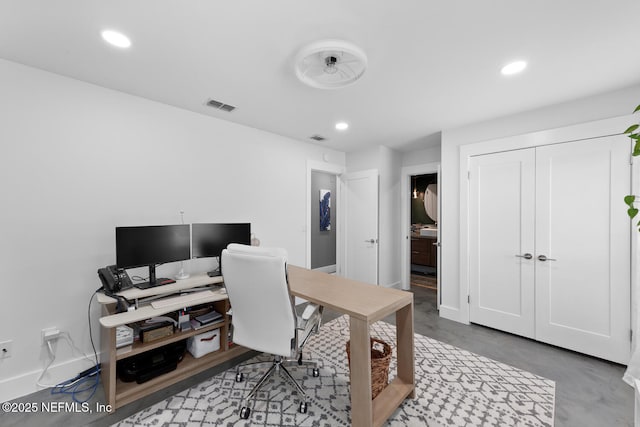 office area with concrete floors