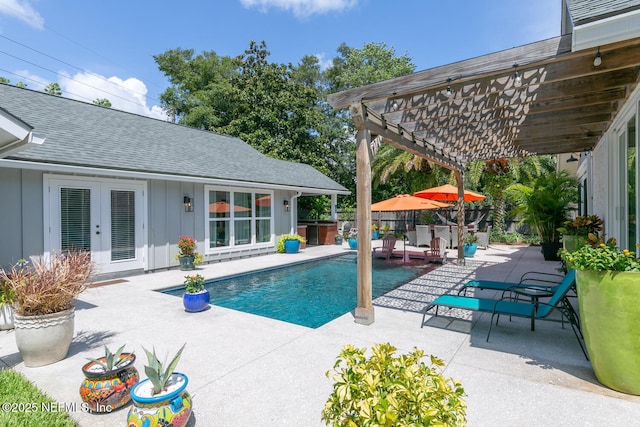 view of swimming pool with a pergola, a patio area, and a hot tub