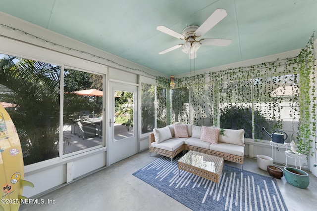 sunroom featuring ceiling fan