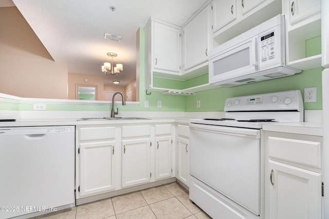 kitchen with white cabinetry, sink, hanging light fixtures, white appliances, and light tile patterned flooring