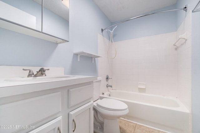 full bathroom with tile patterned floors, shower / bathtub combination, vanity, a textured ceiling, and toilet