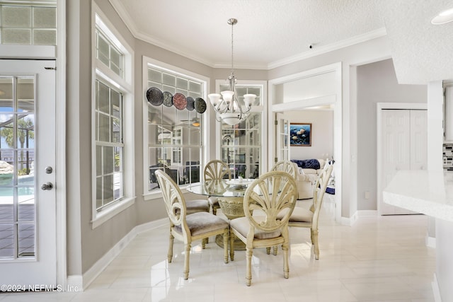 dining space featuring a textured ceiling, crown molding, and a notable chandelier