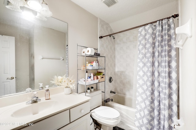 full bathroom featuring vanity, toilet, shower / bathtub combination with curtain, and a textured ceiling