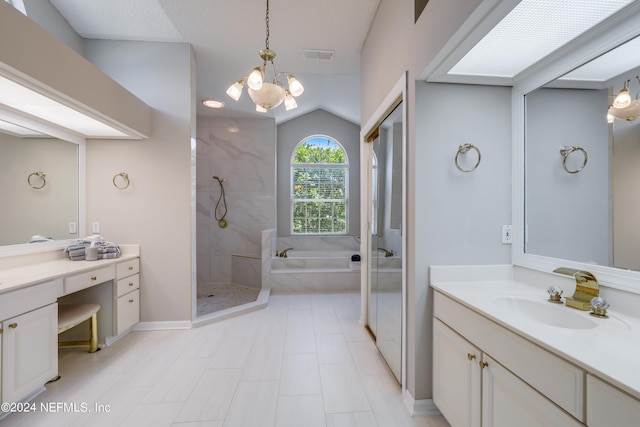 bathroom featuring a chandelier, vanity, separate shower and tub, and lofted ceiling