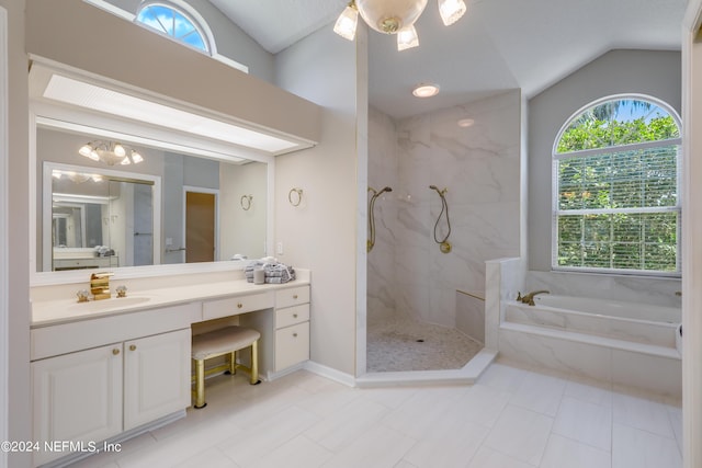 bathroom with vanity, separate shower and tub, and lofted ceiling