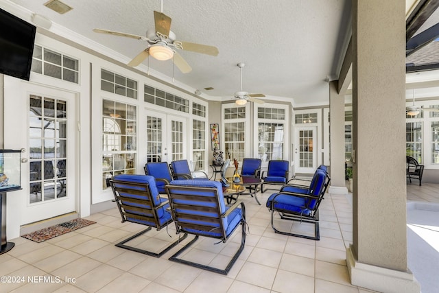 sunroom featuring french doors and ceiling fan