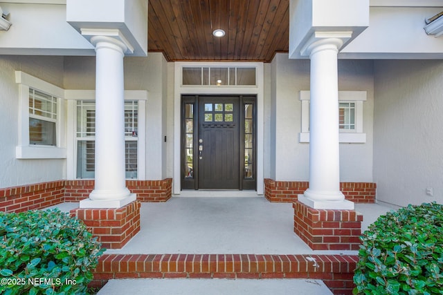 entrance to property featuring a porch