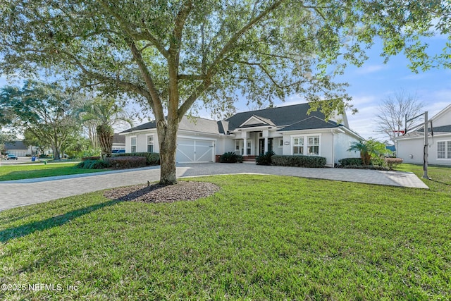 ranch-style house with a front yard and a garage