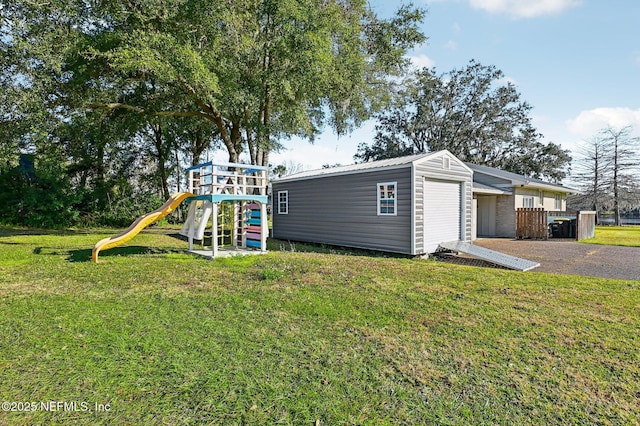 exterior space featuring a playground and a yard