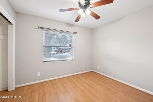 unfurnished bedroom with ceiling fan, a closet, and light wood-type flooring