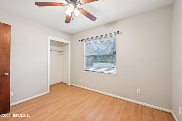 unfurnished bedroom featuring a closet, ceiling fan, and light wood-type flooring