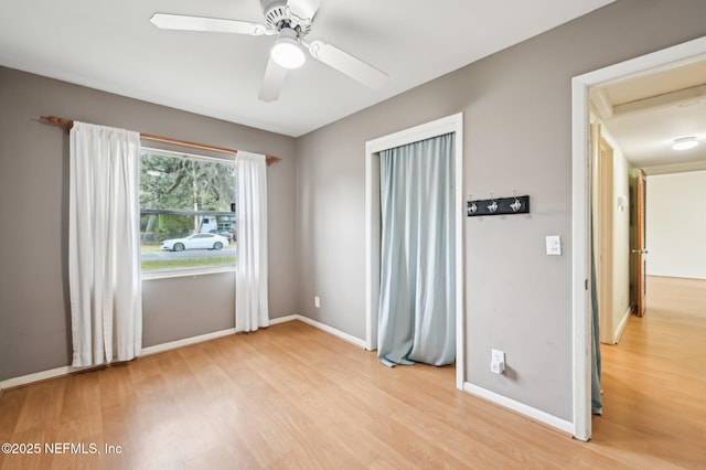 interior space with light wood-type flooring and ceiling fan