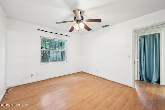 spare room featuring ceiling fan and hardwood / wood-style floors