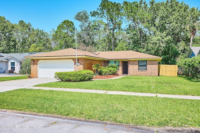 ranch-style home with a front yard and a garage