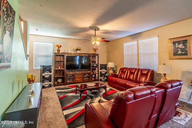 carpeted living room featuring ceiling fan