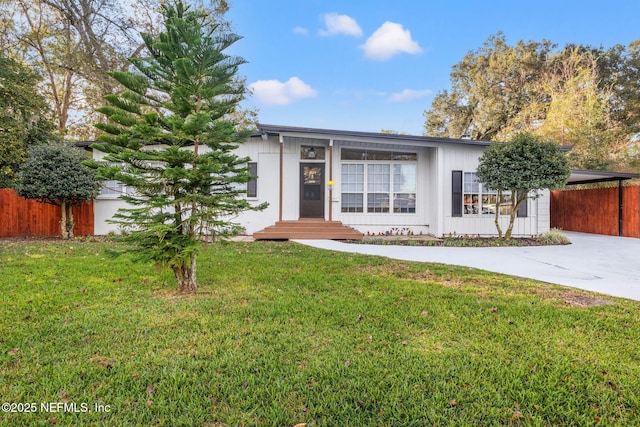 ranch-style house with a front lawn